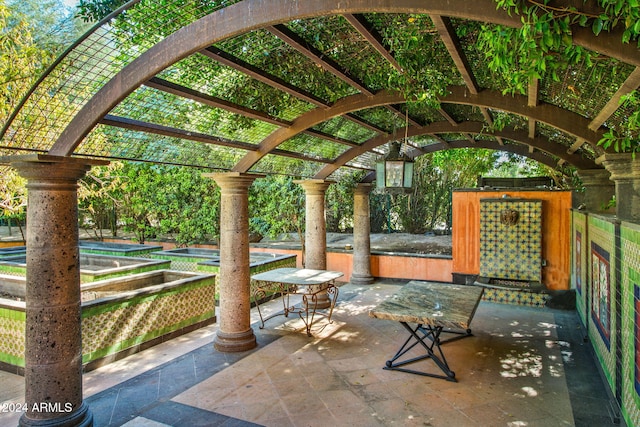 view of patio featuring a pergola