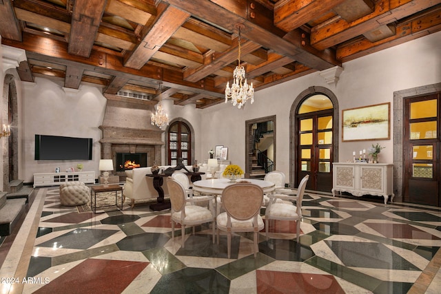 8100 N 68th St, Paradise Valley, AZ 85253 - dining area with a chandelier, arched walkways, beamed ceiling, a premium fireplace, and coffered ceiling