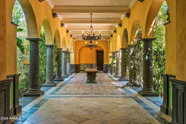 8100 N 68th St, Paradise Valley, AZ 85253 - building lobby featuring beamed ceiling, crown molding, and a towering ceiling