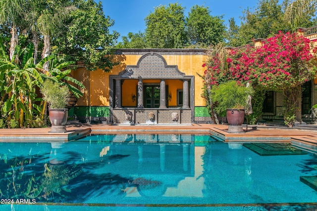8100 N 68th St, Paradise Valley, AZ 85253 - outdoor pool featuring an outdoor structure and an exterior structure