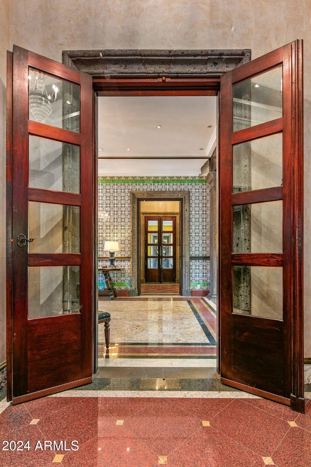 view of exterior entry featuring french doors