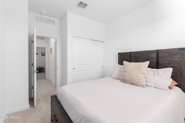 carpeted bedroom with a closet