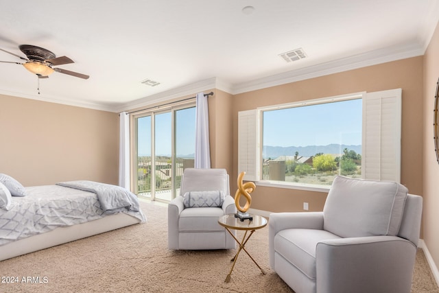 bedroom featuring carpet floors, a mountain view, access to exterior, crown molding, and ceiling fan