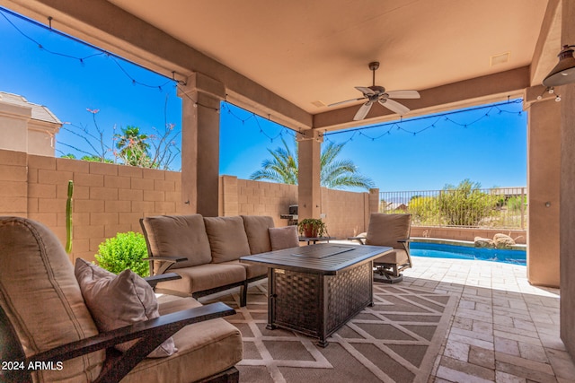 view of patio with ceiling fan, a fenced in pool, and an outdoor living space