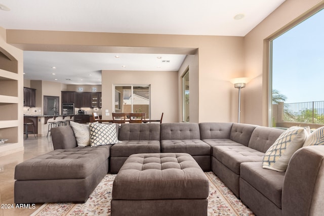 living room featuring sink and built in features