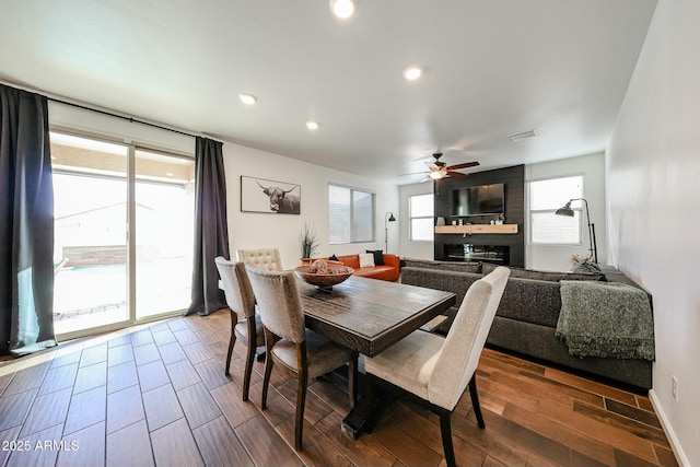 1713 W Cottonwood Ln, Phoenix, AZ 85045 - dining area featuring ceiling fan, recessed lighting, a fireplace, wood finished floors, and visible vents