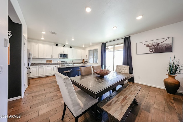1713 W Cottonwood Ln, Phoenix, AZ 85045 - dining room featuring recessed lighting, visible vents, baseboards, and wood finish floors