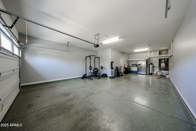 1713 W Cottonwood Ln, Phoenix, AZ 85045 - garage featuring baseboards, stainless steel refrigerator with ice dispenser, gas water heater, and a garage door opener