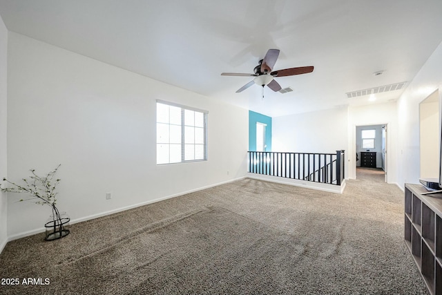 1713 W Cottonwood Ln, Phoenix, AZ 85045 - carpeted spare room featuring baseboards, visible vents, and a ceiling fan