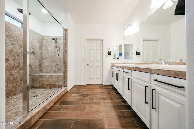 1713 W Cottonwood Ln, Phoenix, AZ 85045 - bathroom with tiled shower, a sink, baseboards, and double vanity