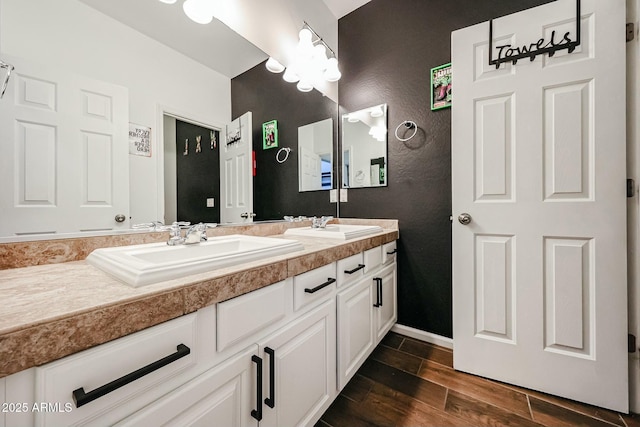 1713 W Cottonwood Ln, Phoenix, AZ 85045 - full bath with baseboards, double vanity, a sink, and wood tiled floor