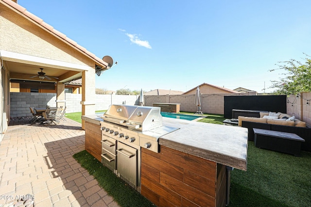 1713 W Cottonwood Ln, Phoenix, AZ 85045 - view of patio featuring ceiling fan, an outdoor kitchen, a fenced backyard, and an outdoor living space