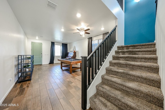 1713 W Cottonwood Ln, Phoenix, AZ 85045 - staircase with visible vents, a ceiling fan, wood finished floors, billiards, and baseboards