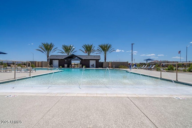 community pool featuring fence