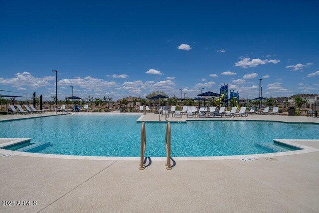community pool featuring a patio area