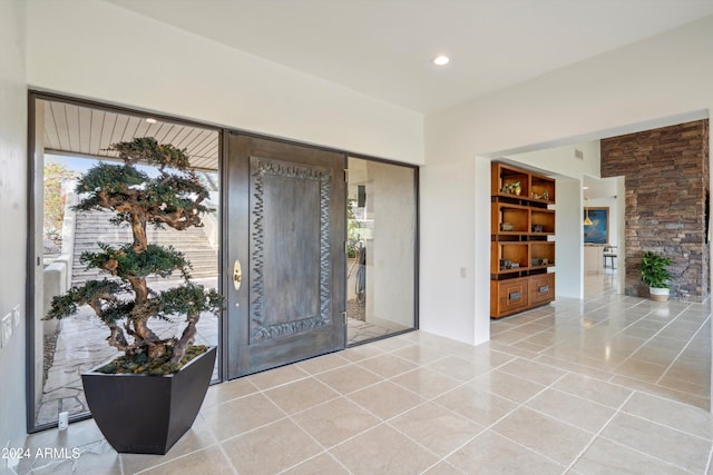 foyer entrance featuring light tile patterned floors