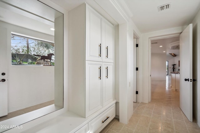 mudroom with light tile patterned flooring