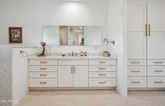 bathroom with tile patterned floors and vanity