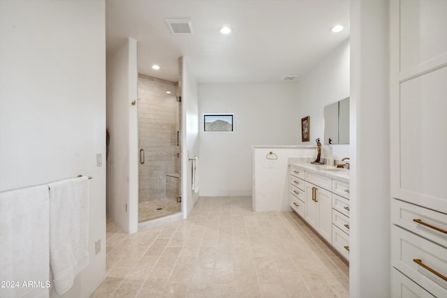 bathroom with vanity and an enclosed shower