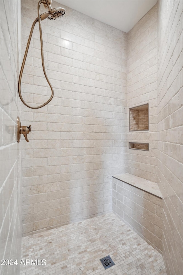 bathroom featuring tiled shower