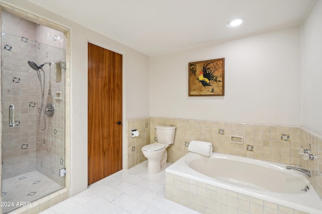 bathroom featuring separate shower and tub, tile patterned floors, and toilet