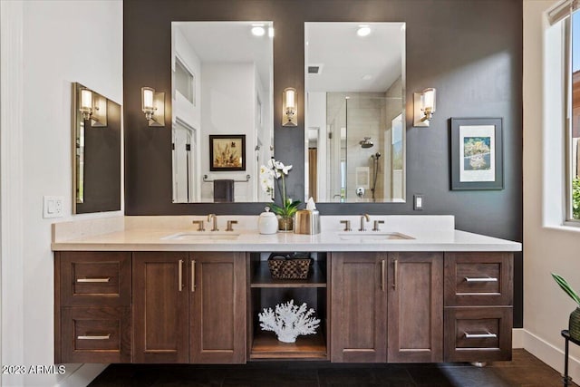 bathroom featuring vanity, tile patterned floors, and a shower with shower door