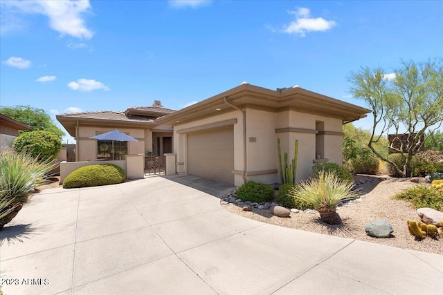 prairie-style home featuring a garage