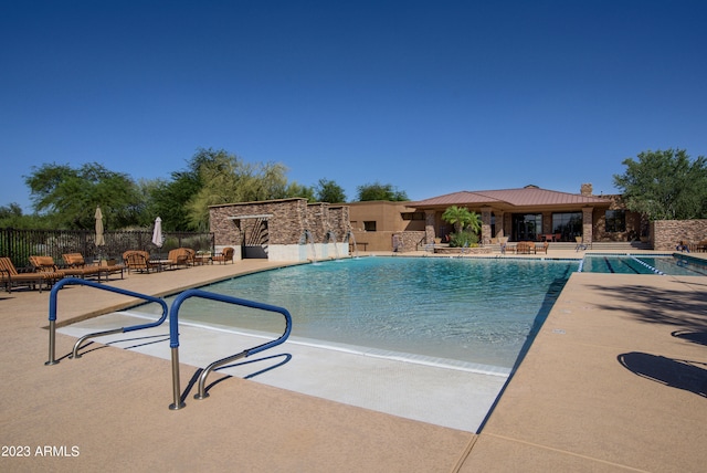 view of pool featuring a patio and pool water feature