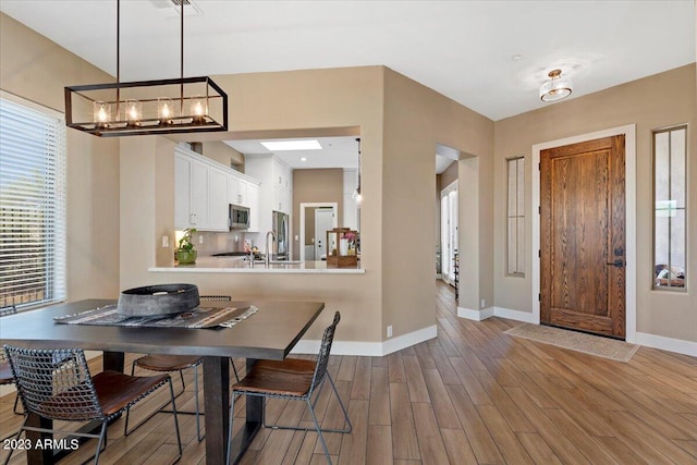 dining area featuring hardwood / wood-style floors