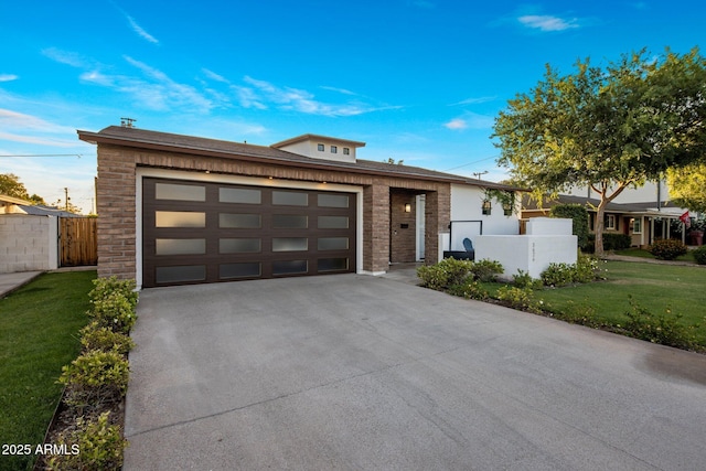 view of front facade featuring driveway, a garage, and brick siding