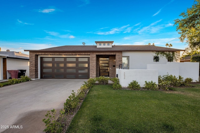 view of front of home featuring concrete driveway and a garage