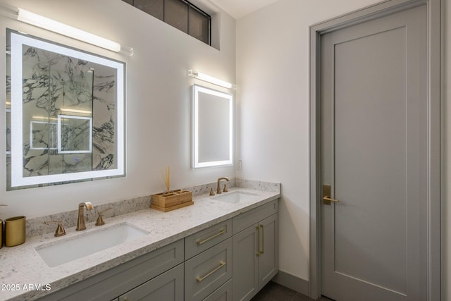 full bathroom with double vanity and a marble finish shower