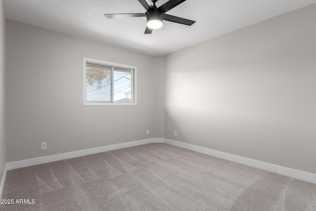 empty room featuring light carpet and ceiling fan