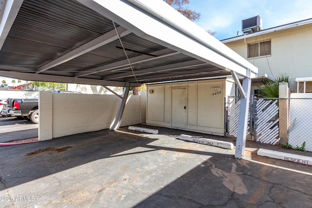 view of vehicle parking featuring a carport