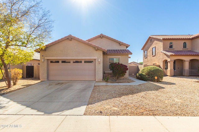 mediterranean / spanish-style house featuring a garage