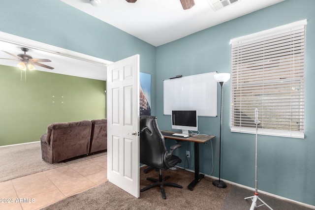 carpeted home office with ceiling fan