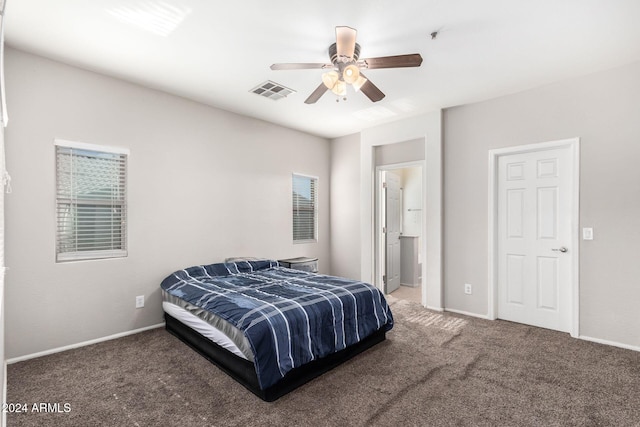 bedroom featuring ceiling fan and dark carpet