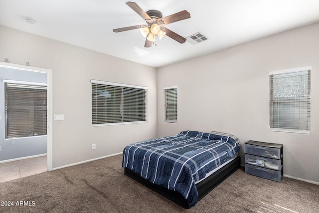 bedroom featuring ceiling fan and carpet flooring