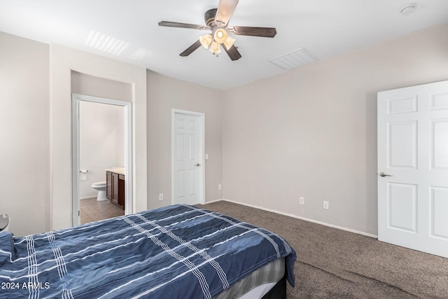 carpeted bedroom featuring ceiling fan and ensuite bathroom