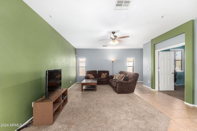 living room with ceiling fan and light colored carpet