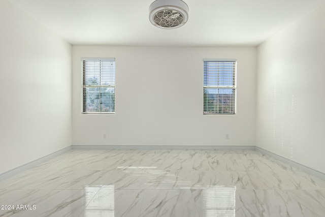 spare room with a wealth of natural light