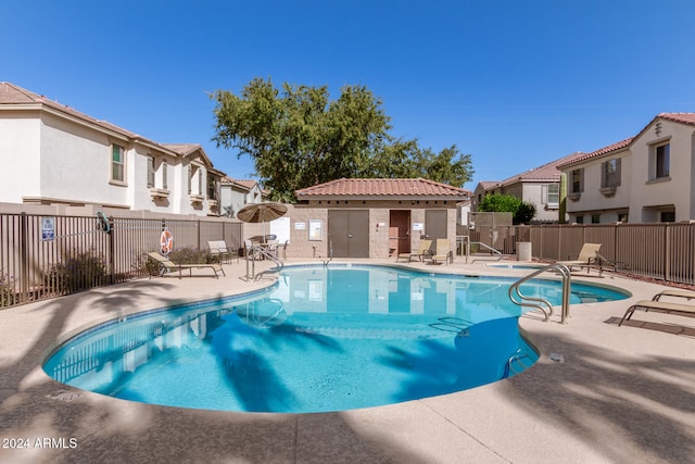 view of swimming pool featuring a patio area