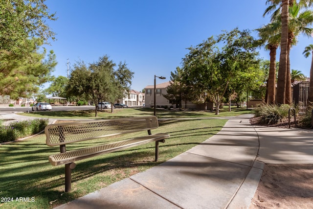 view of home's community featuring a lawn