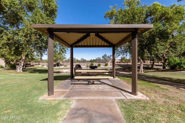 view of property's community featuring a gazebo, a yard, and a patio area