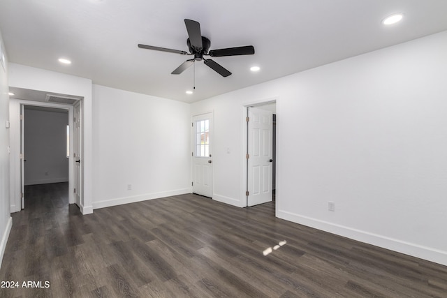 unfurnished room featuring ceiling fan and dark hardwood / wood-style flooring