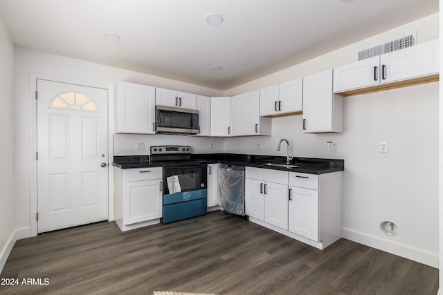 kitchen with white cabinetry, stainless steel appliances, sink, and dark hardwood / wood-style flooring