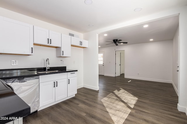 kitchen with white cabinets, ceiling fan, sink, and dark hardwood / wood-style flooring