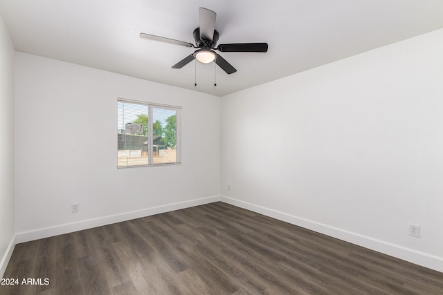 unfurnished room with ceiling fan and dark hardwood / wood-style flooring