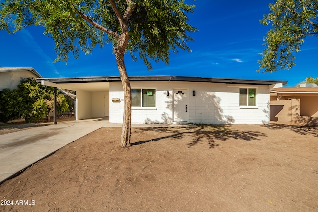 view of front of house with a carport