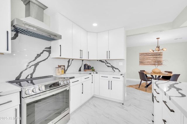 2926 N 16th Ave, Phoenix, AZ 85015 - kitchen with an inviting chandelier, wall chimney range hood, light countertops, electric stove, and marble finish floor